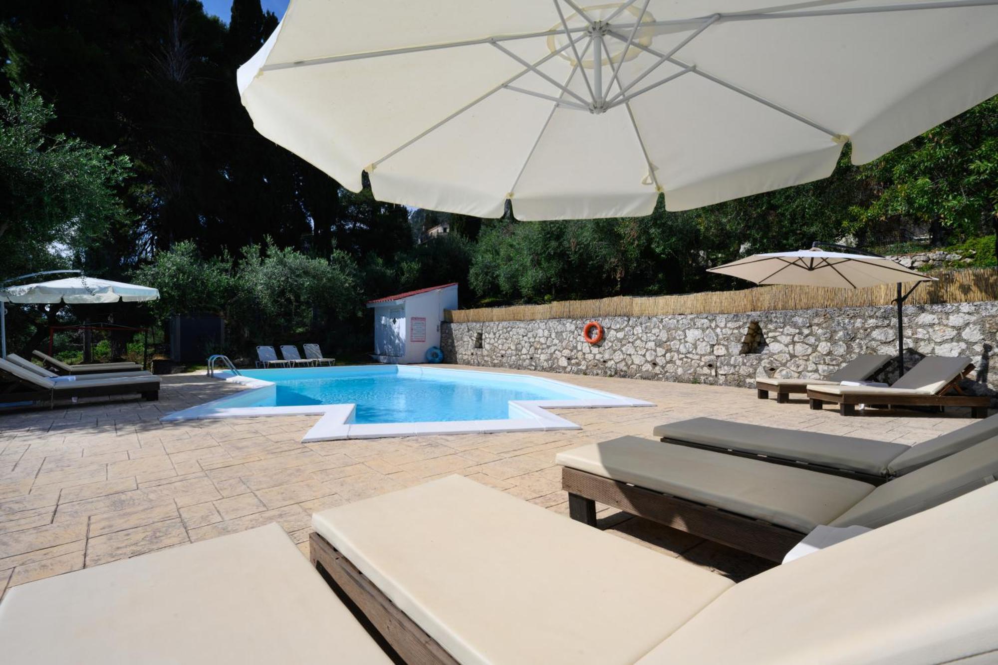 Olive Grove Poolside Apartments Бенитсес Экстерьер фото